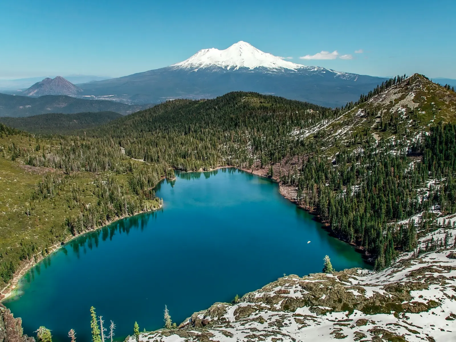 Snow-capped Mount Shasta reflected in a lake