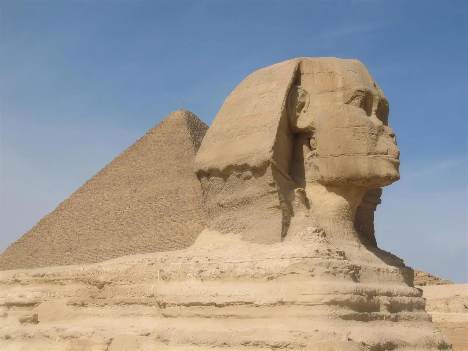 The Great Sphinx of Giza with a pyramid behind