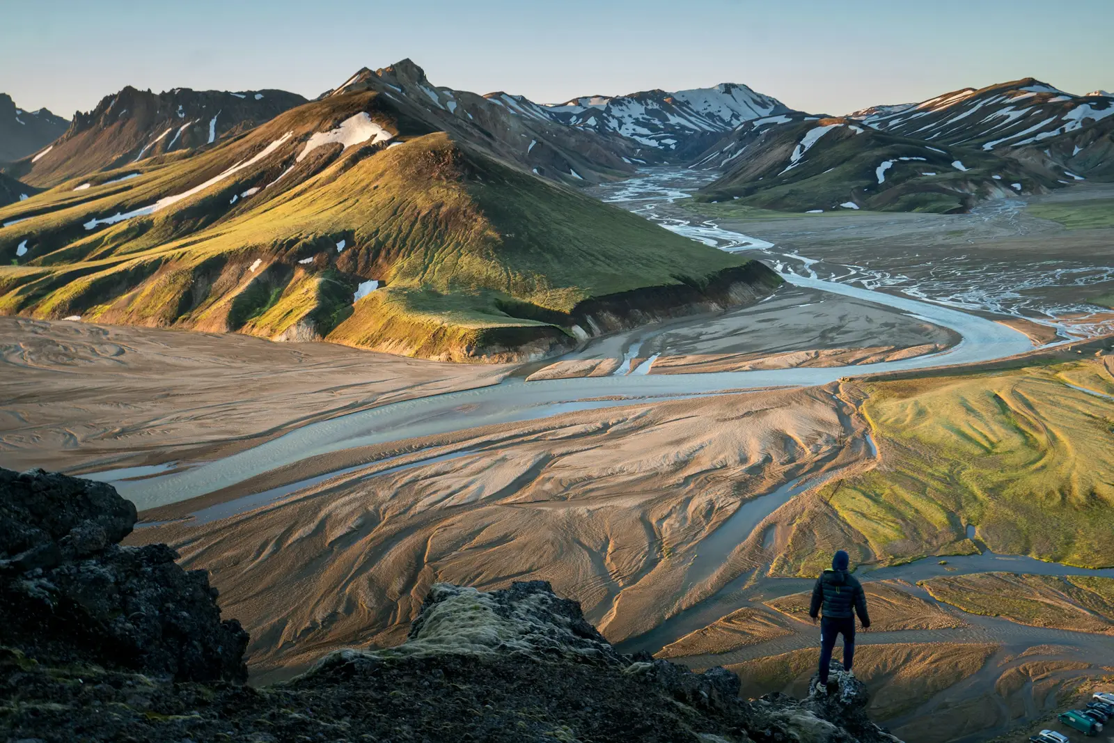Person quietly contemplating a vast Icelandic landscape