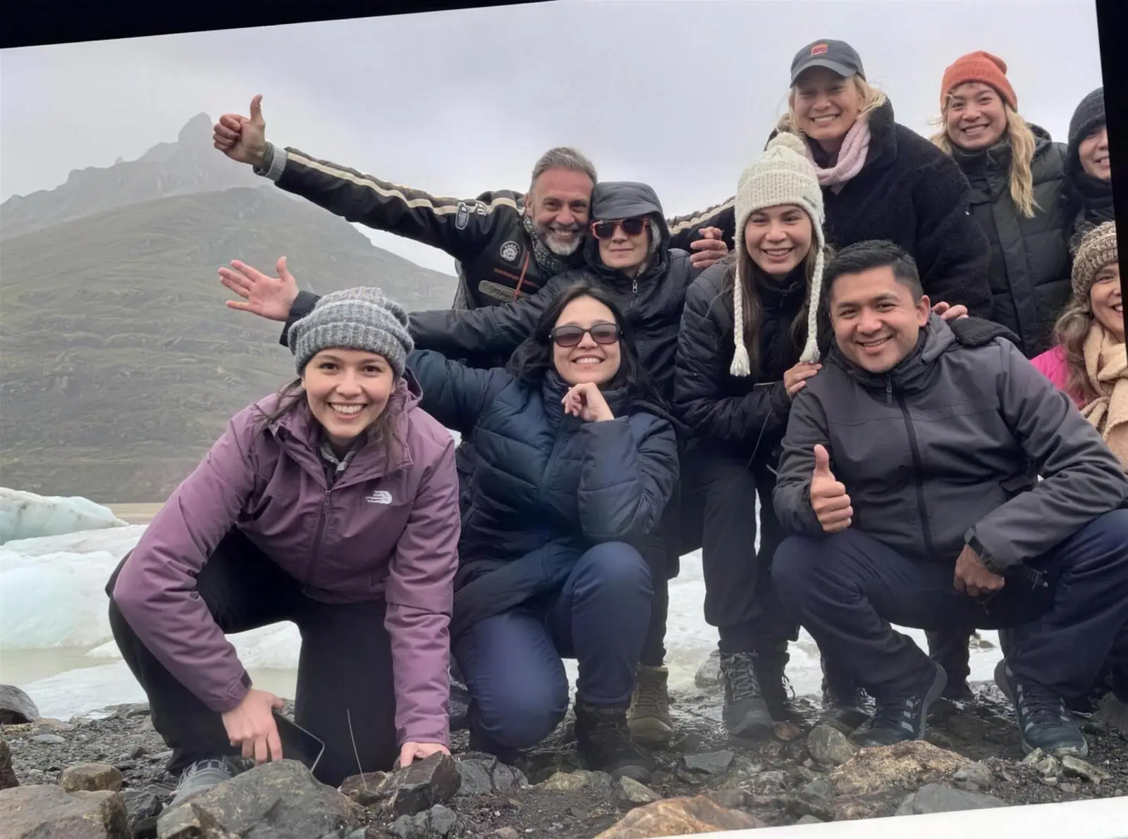 The tribe celebrating in front of an Icelandic glacier