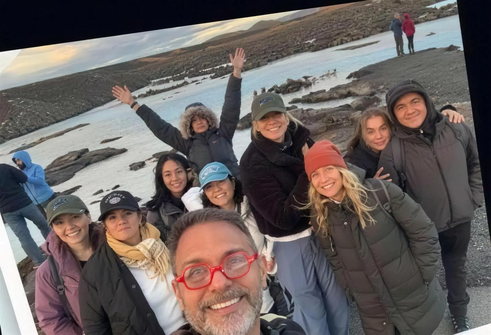 Group selfie at dusk by a geothermal lagoon
